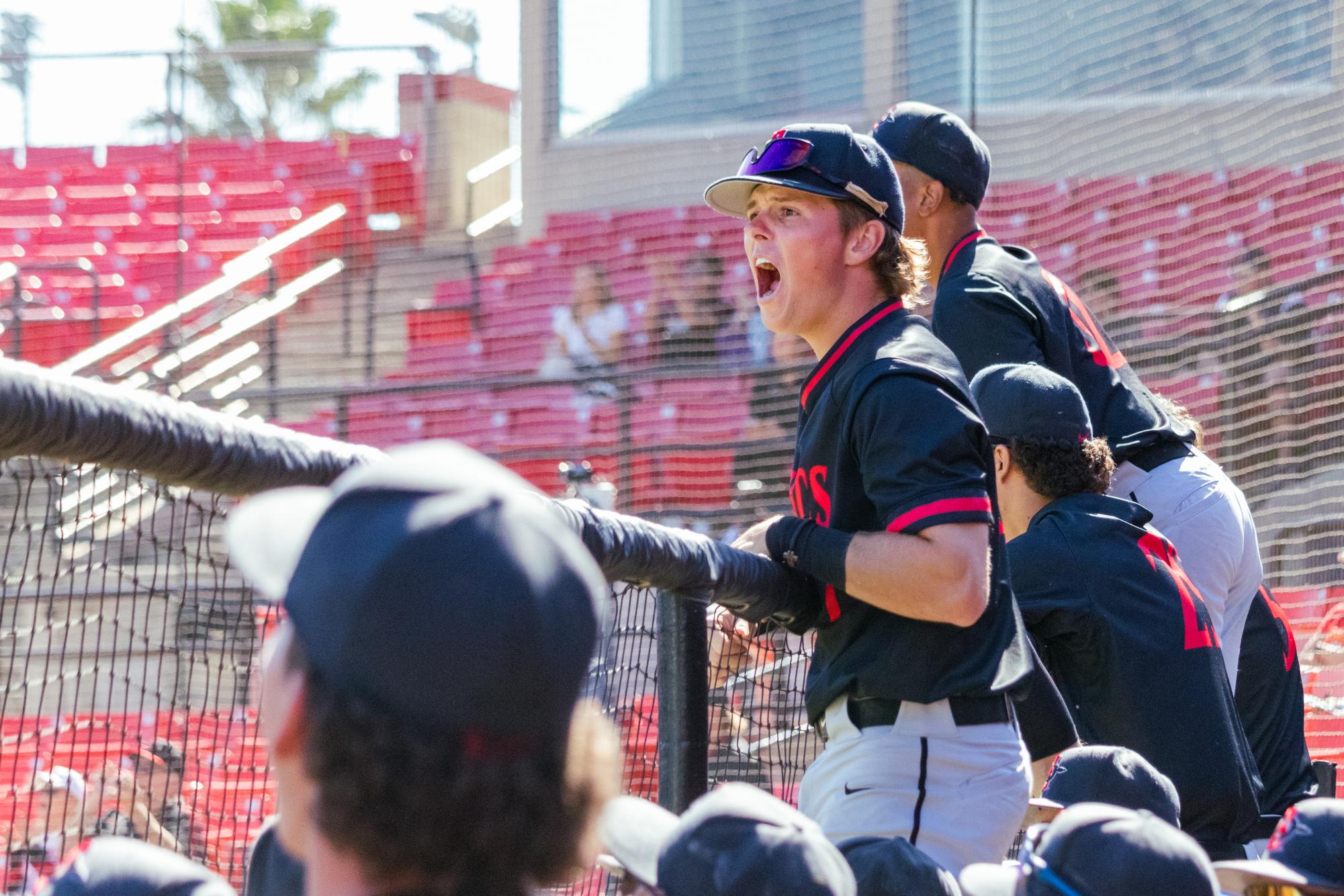 Cade Martinez (7) yells from the dugout during an exhibition game against Central Arizona College at Tony Gwynn Stadium on Oct. 28, 2023.