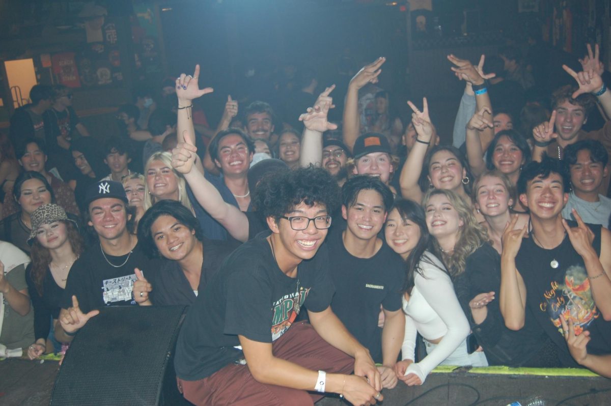 James Burgos poses with friends and fans at the end of a headlining concert in March 2022. (Photo Courtesy of James Burgos)
