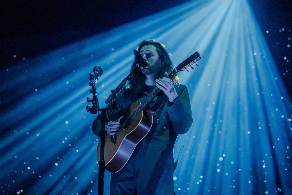 Hozier performs under moody lighting at Petco Park on Oct. 29.