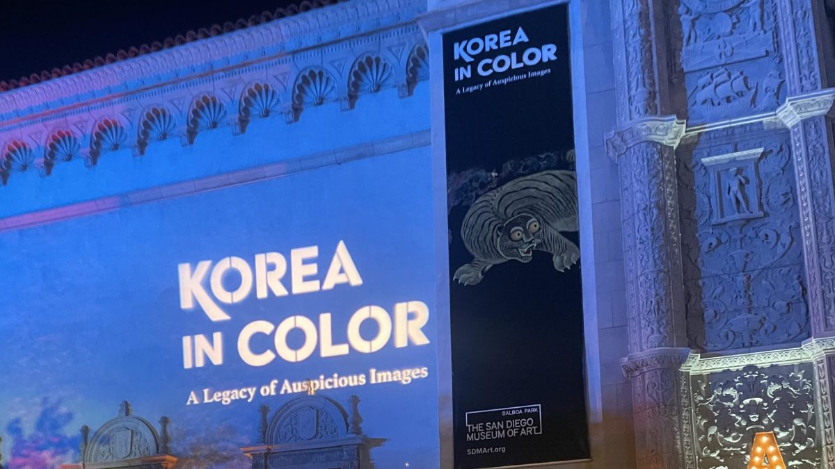 Korea in Color: A Legacy of Auspicious Images is projected on the side of the San Diego Museum of Art.