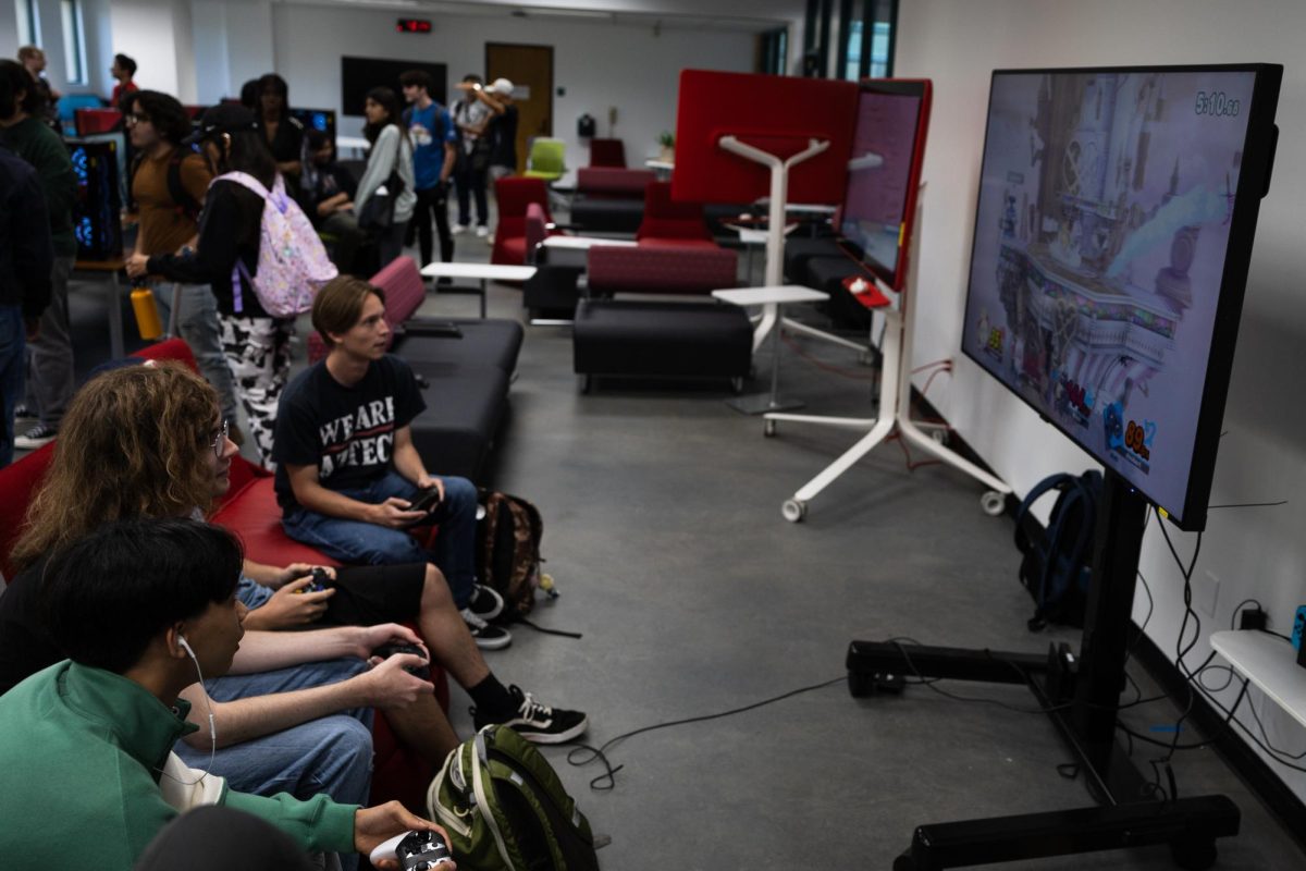 Members of the Aztec Gaming Club join each other in a game of Super Smash Bros.