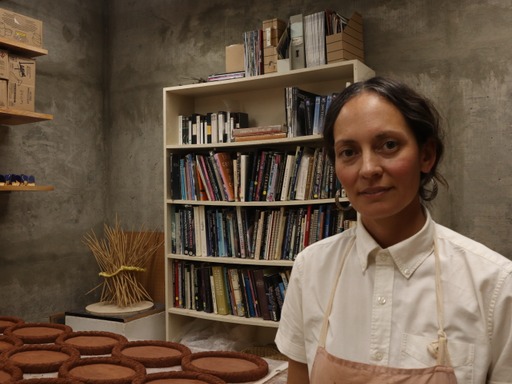 Ceramics artist and MFA student, Sarah Garcia, is pictured in her studio where she works on future projects