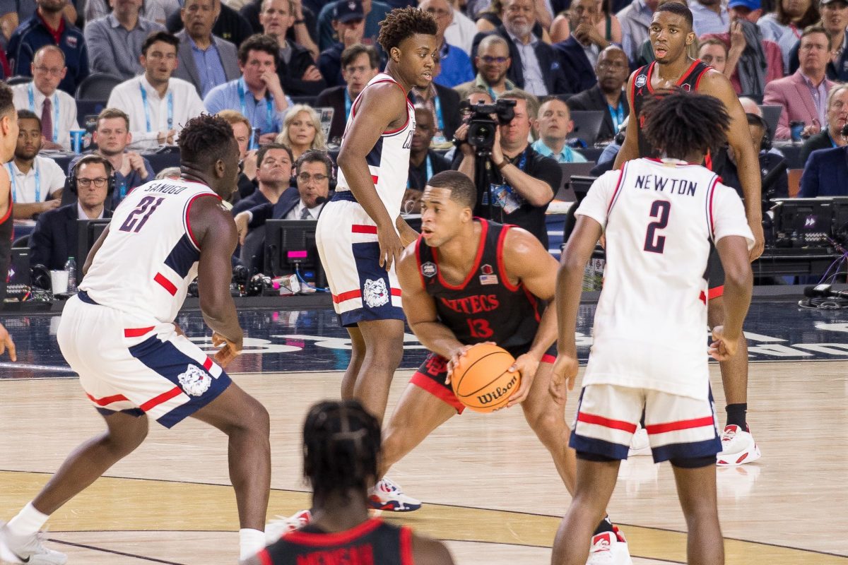The Huskies try to block forward, Jaedon LeDee as he attempts to make a shot on April 3, 2023 at the Final Four match up (SDSU vs. UCONN) at the NRG Stadium, in Houston, TX. 