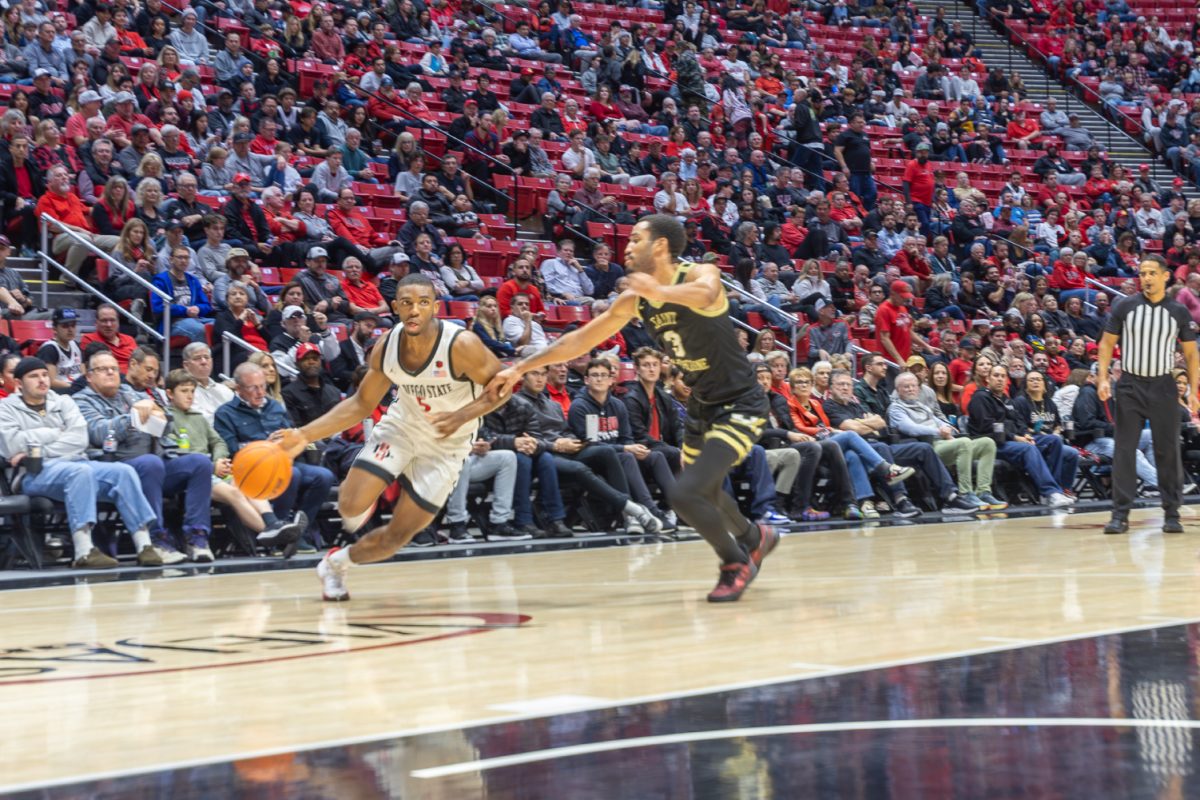 San Diego State guard Lamot Butler drives baseline against Saint Katherine guard Maur Tablada on Tuesday, Dec. 19 at Viejas Arena. The Aztecs won 91-57 in their first game since Dec. 9.