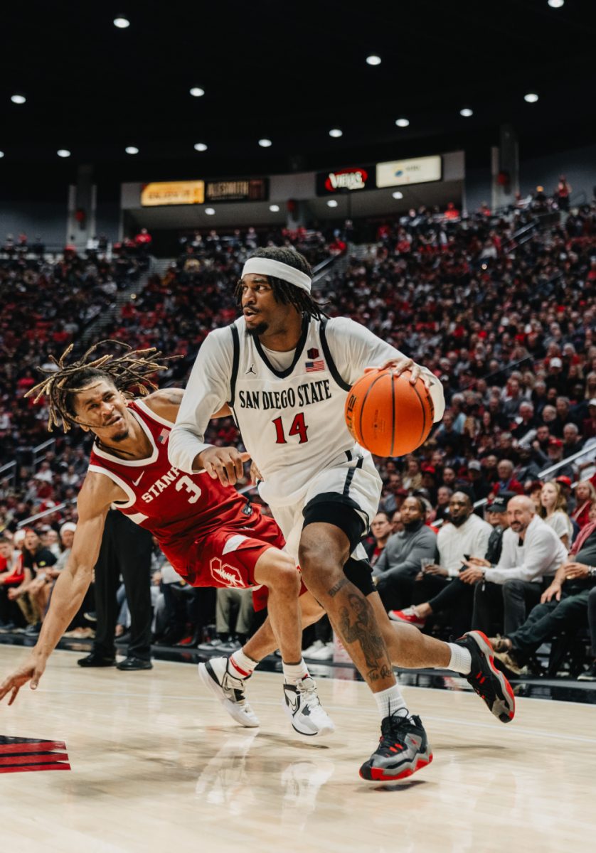 San Diego State guard Reese Waters cuts baseline past Stanford guard Kanaan Carlyle on Thursday, Dec. 21 at Viejas Arena. Waters scored all of his 8 points and finished +13 in the second half.