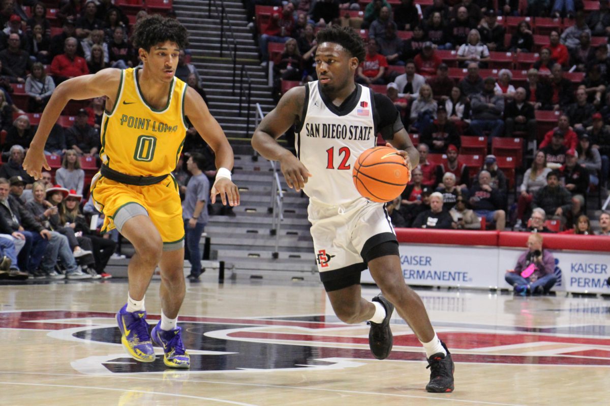 San Diego State guard Darrion Trammell drives past a defender earlier this season at Viejas Arena. Trammell scored all 11 of his points in the second half of the Aztecs 79-73 loss at Grand Canyon University on Tuesday, Dec. 5.