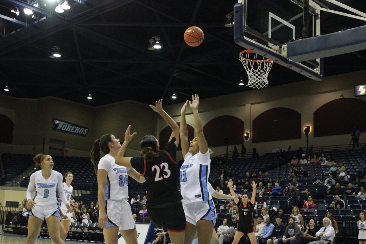 San Diego State forward Kim Villalobos takes a shot over a defender earlier this season at University of San Diego. She recorded a 10 point, 14 rebound double-double in the Aztecs overtime loss at Air Force on Wednesday, Jan.3. 