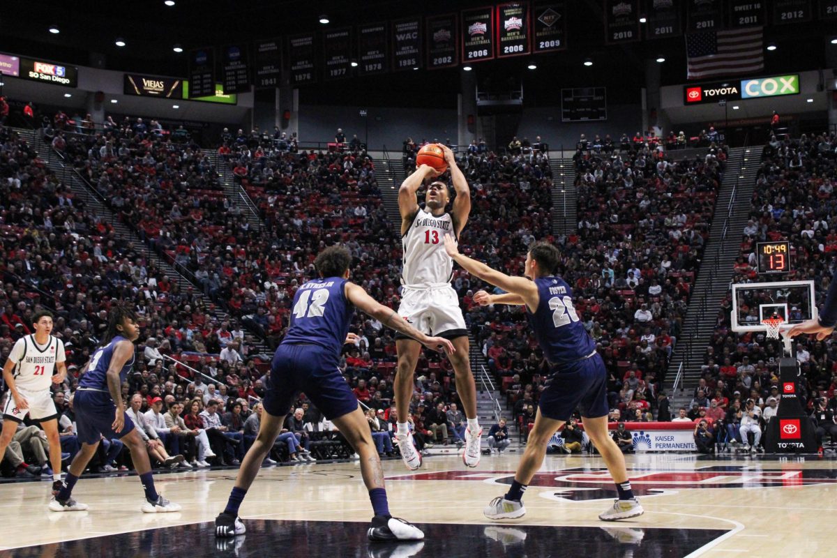 San Diego State forward Jaedon LaDee attempts a shot over a pair of Nevada defenders earlier this season at Viejas Arena. LeDee led the team in scoring with 13 points in SDSUs 67-66 loss at Boise State on Saturday, Jan. 20. 