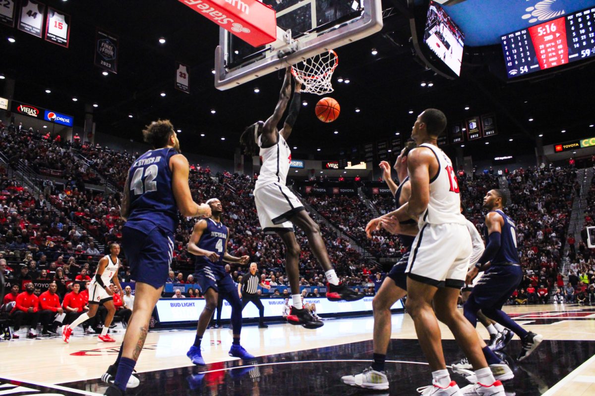 San Diego State forward Jay Pal hammers home one of his two tip-dunks against Nevada on Wednesday, Jan. 17 at Viejas Arena. Pals 10 rebounds were a personal best at SDSU in the Aztecs 71-59 win over the Wolf Pack.