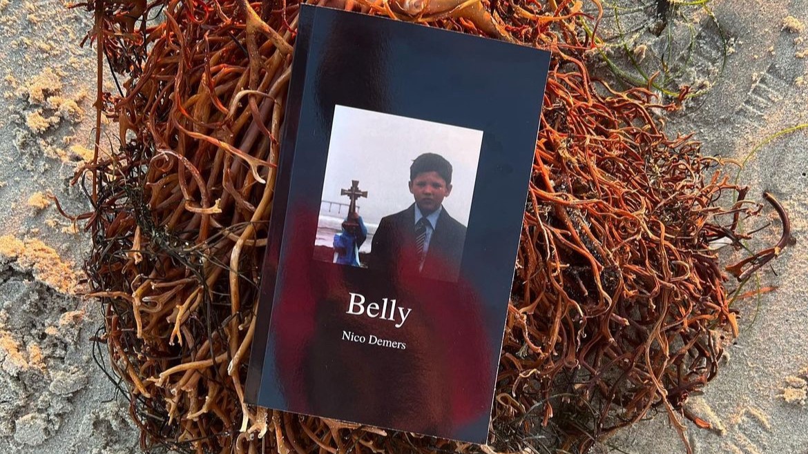 A copy of Belly rests on a nest of seaweed on a beach. Photo courtesy of Nico Demers.