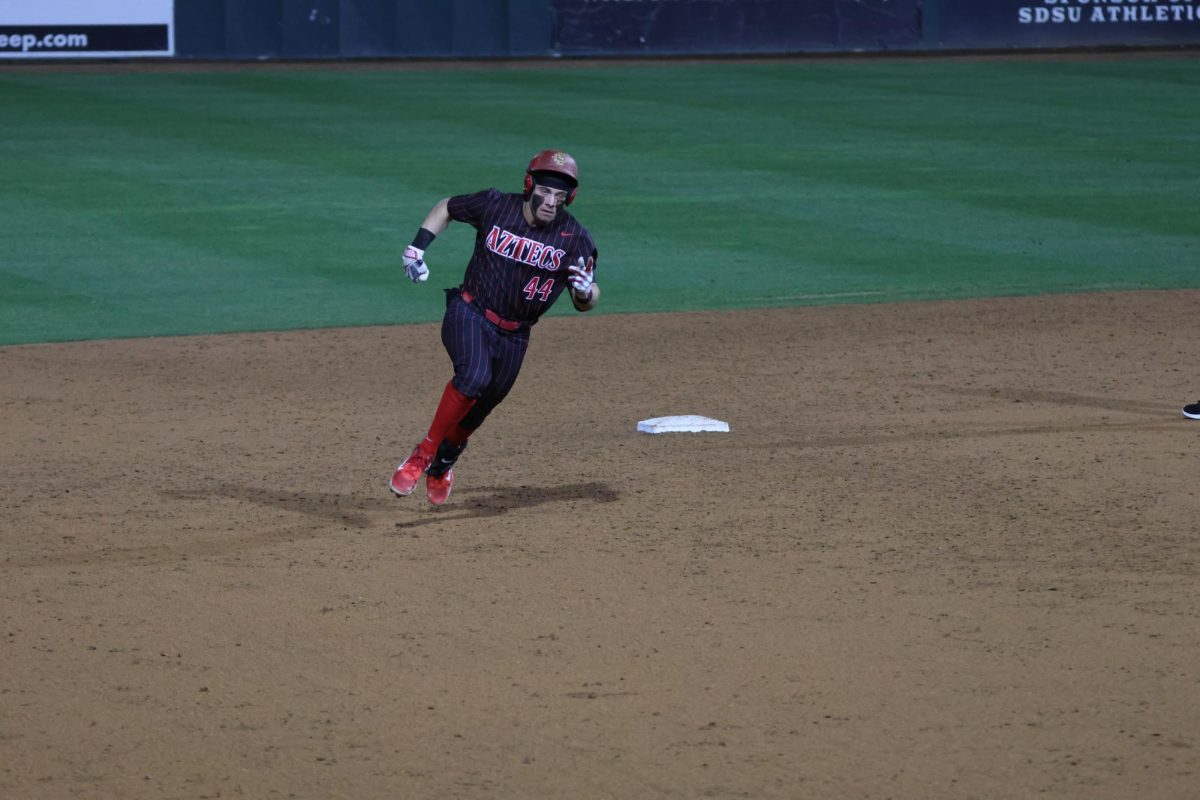 San Diego State utility Colby Turner runs past a plate to reach home, after a hit against Missouri on Friday, Feb. 23 at Tony Gwynn Stadium. The Aztecs dominated the Tigers as Turner recorded three hits.  
