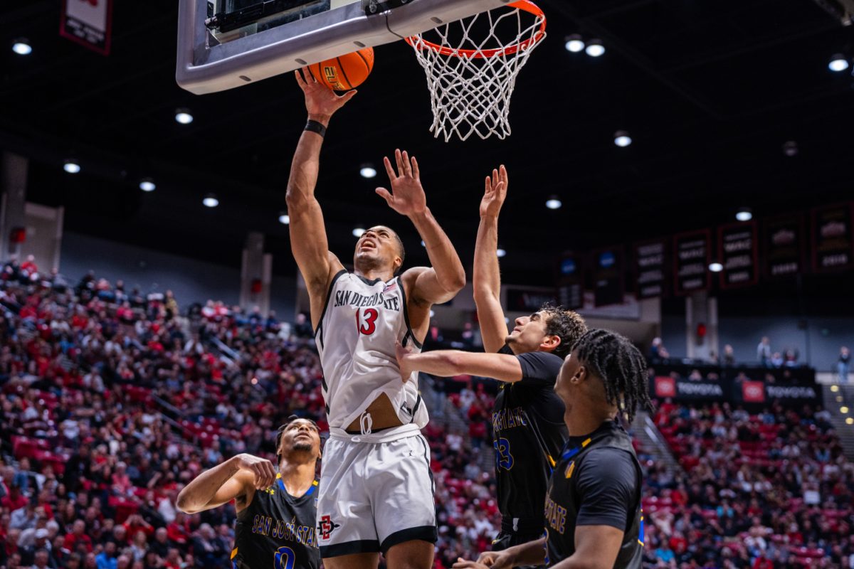 San Diego State forward Jaedon LeDee battles through the San José State defense during the Aztecs 72-64 win over the Spartans on Tuesday, Feb. 27 at Viejas Arena. LeDee finished with 27 points and 11 rebounds, becoming the first Aztec to record 11 double-doubles in a season since Jalen McDaniels in 2018-2019.