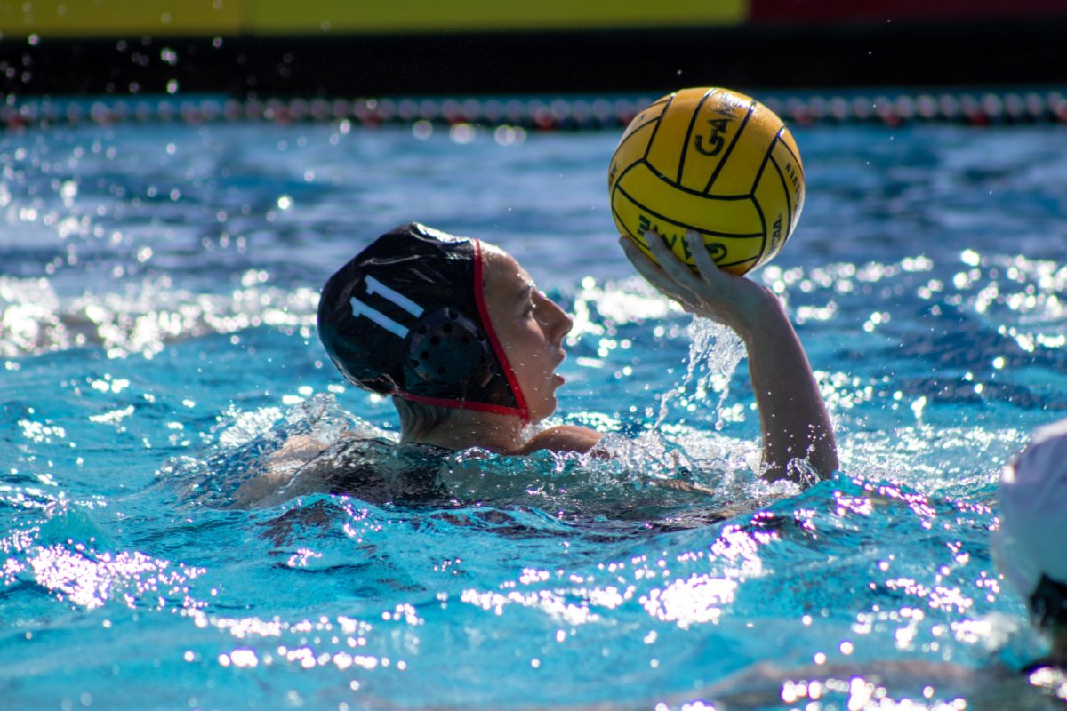 San Diego State attacker Claudia Valdes looks to move the ball against No. 12 Long Beach State on Saturday, Nov. 10 at the Aztec Aquaplex. Valdes scored a goal in the 14-9 loss to the 49ers.