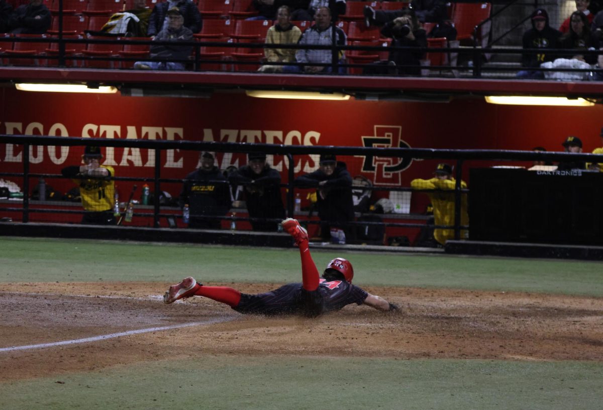 San Diego State outfielder Irvin Weems dives towards home plate earlier this season at Tony Gwynn Stadium. Weems helped the Aztecs with their only score off a leadoff double in the 11-1 loss to the Bulldogs on Sunday, Mar. 3rd. 