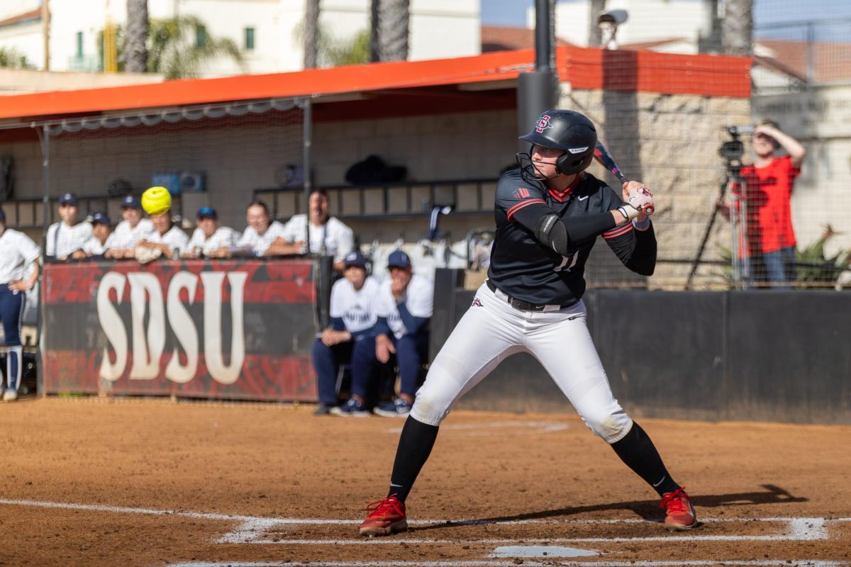 San Diego State utility Cali Decker swings at bat as the ball comes earlier this season at SDSU Softball Stadium. The Aztecs took home the series against Fresno State 2-1 over the past weekend. 