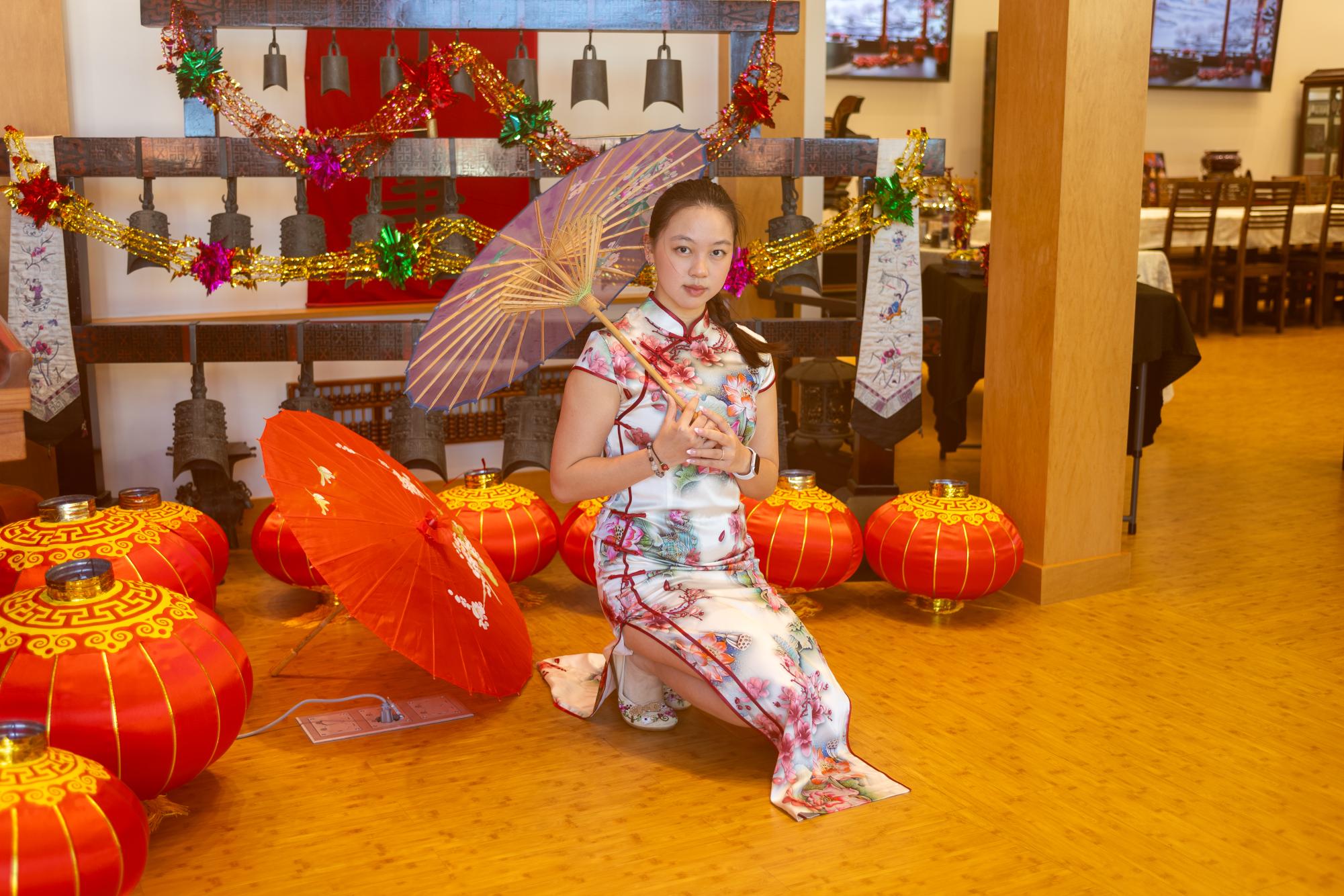 Isabella Peng poses in a traditional Chinese gown during the Lunar New Year celebration event at the Chinese Cultural Center on Tuesday, Feb. 13.