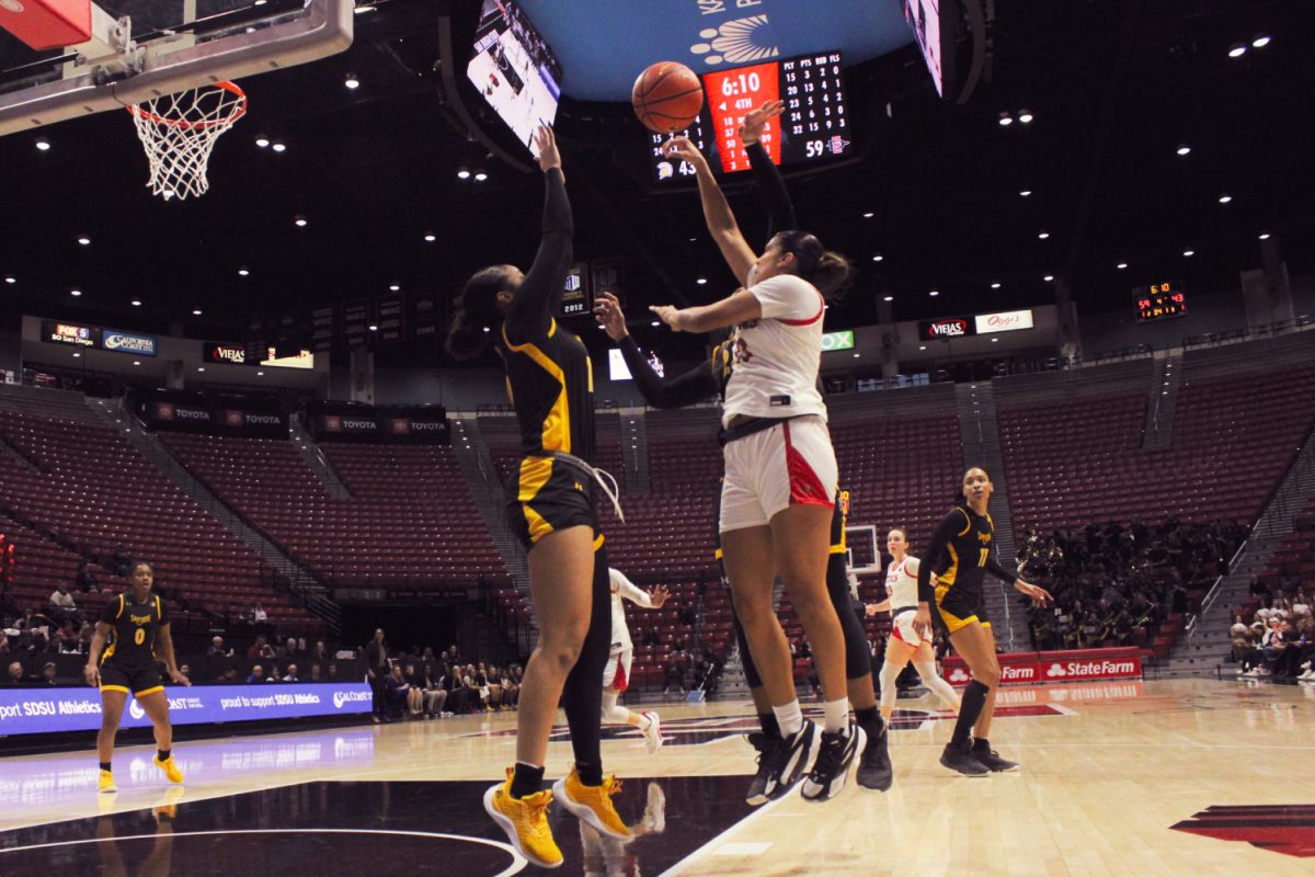 San Diego State forward Kim Villalobos rises against a pair of San José State defenders earlier this season at Viejas Arena. The Aztecs open the 2024 Mountain West Championship Tournament  as the No. 7 seed, facing the No. 10 seed Spartans on Sunday, March 10 at 4:30 p.m.
