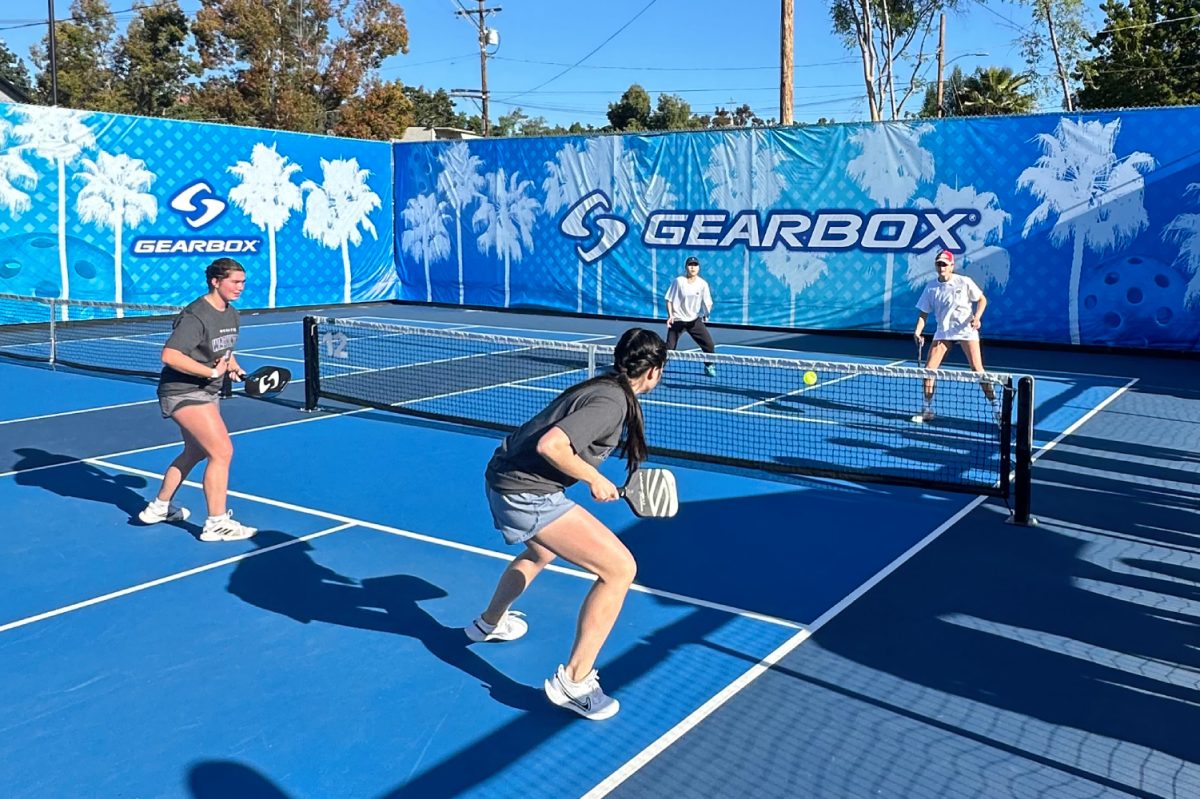 Aztec Pickelball Club members (from left in white shirts) Natsune Tokumi and Emily Miller compete at the inaugural National Collegiate Pickelball Association National Champioships at The Hub in Spring Valley, California. Image courtesy of Kellen Brown, Aztec Pickelball Club