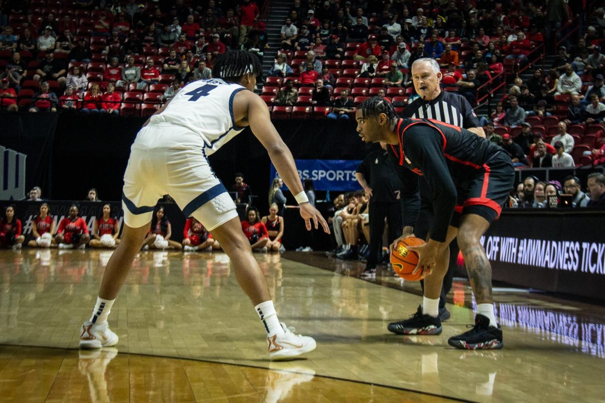 San Diego State guard Reese Waters faces Utah State guard Ian Martinez one on one in the semifinals of the 2024 Mountain West Mens Championship on Friday, March 15 at the Thomas & Mack Center in Las Vegas. The Aztecs defeated the Aggies 86-70 to advance to the Mountain West Championship. 