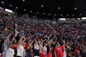 Fans pack Viejas Arena with their fingers up in hopes of a made free throw earlier in the Mens Basketball season vs. Point Loma on Monday, Nov. 23, 2023. 
