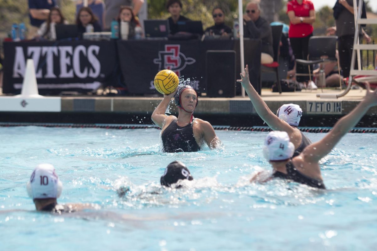 Amanda Chambers gives the goal a look before passing the ball against Harvard on Sunday, Mar. 10 at the Aztec Aquaplex. 