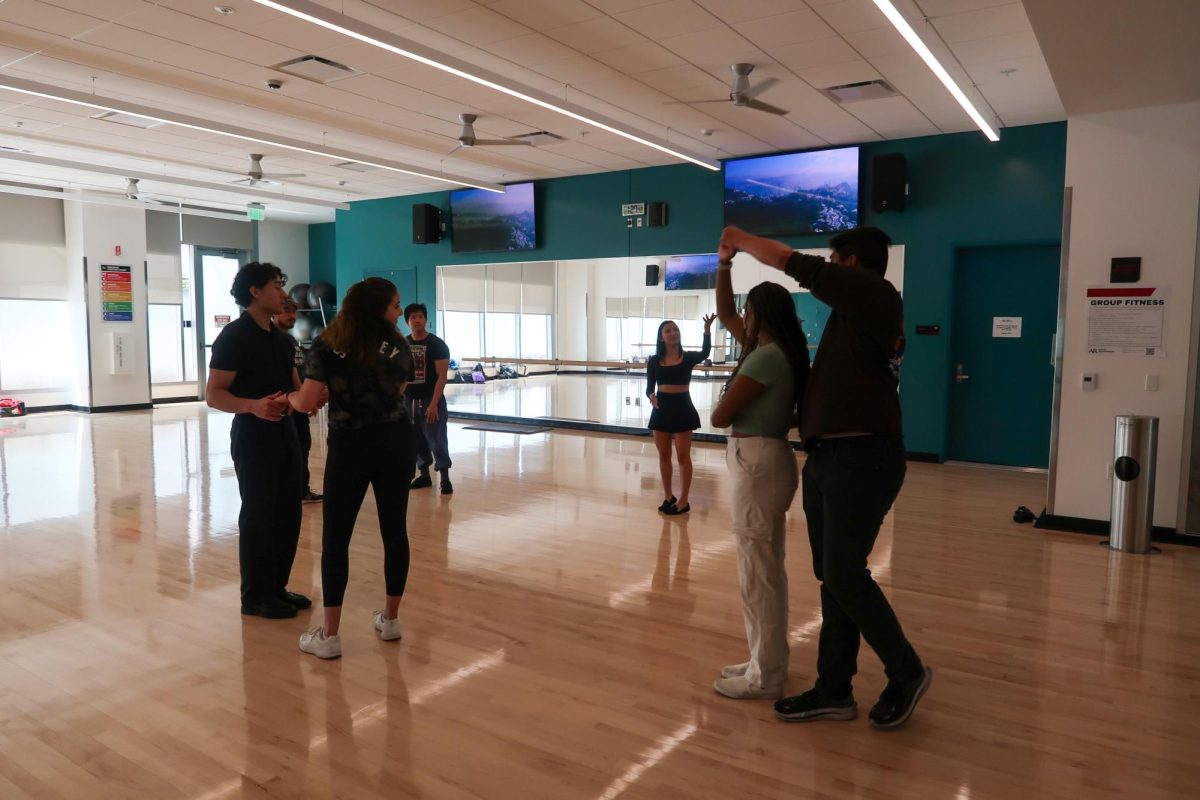 Members of the Latin Dance Club learn new steps during one of their weekly meetings. Photo Courtesy of Alejandro Cruz