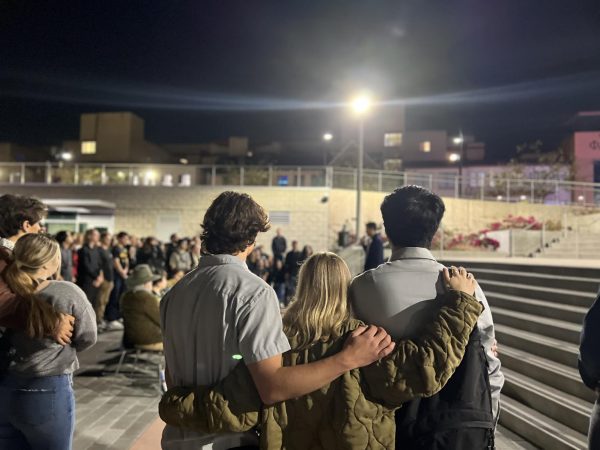 Attendees embrace during a vigil held in memory of Max Macks Aboudarham at San Diego State Universitys Aztec Recreation Center courtyard on April 11, 2024