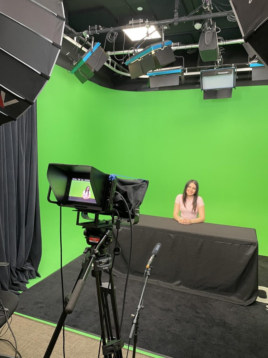 Jazlyn Dieguez prepares for her first Daily Aztec Live broadcast in Backdoor Studio on Feb. 20, 2024. (Photo courtesy of Jazlyn Dieguez)