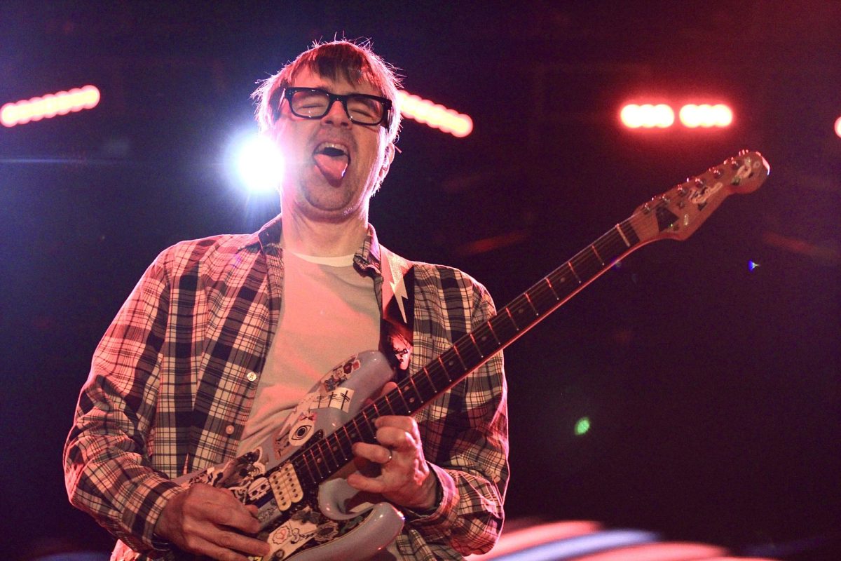 Weezer%E2%80%99s+lead+singer+Rivers+Cuomo+plays+his+guitar+on+the+main+stage+at+Wonderfront+2024+on+May+11.