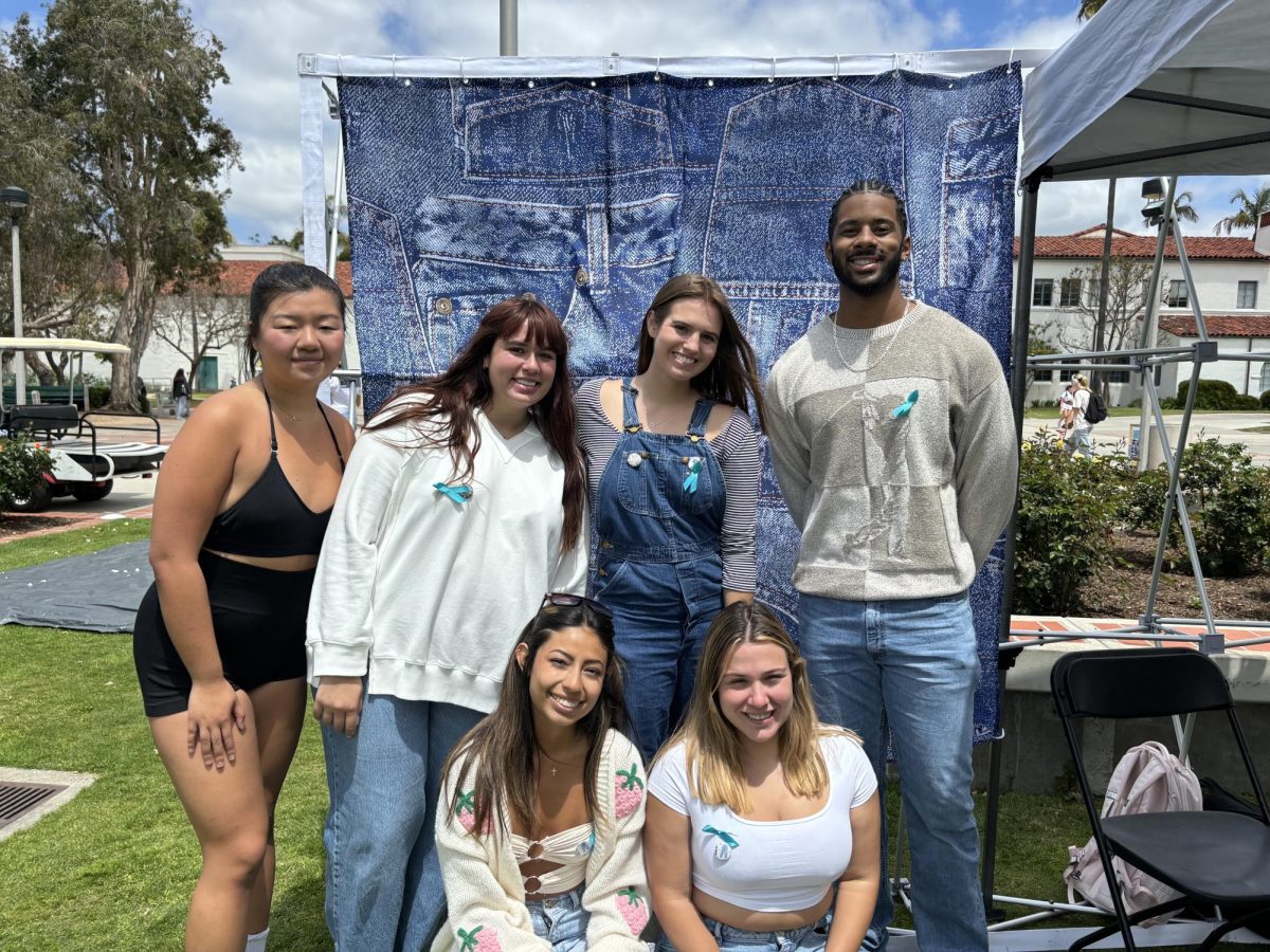 Students pose for Denim Day event at Campanile Walkway on April 24, 2024