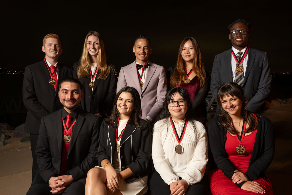 Nine San Diego State University students pose as recipients of the Quest for the Best awards.

Courtesy of Chelsea Lombrozo