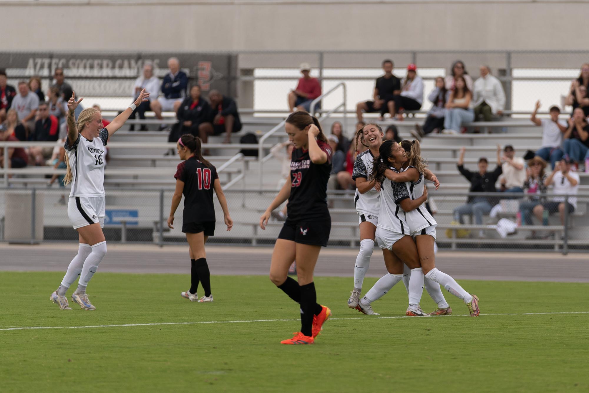 Freshman Midfielder Alexyz Nakamoto being embraced by her teammates after obtaining her first collegiate goal leading to a victory against Eastern Washington on Sunday Sept. 15.  