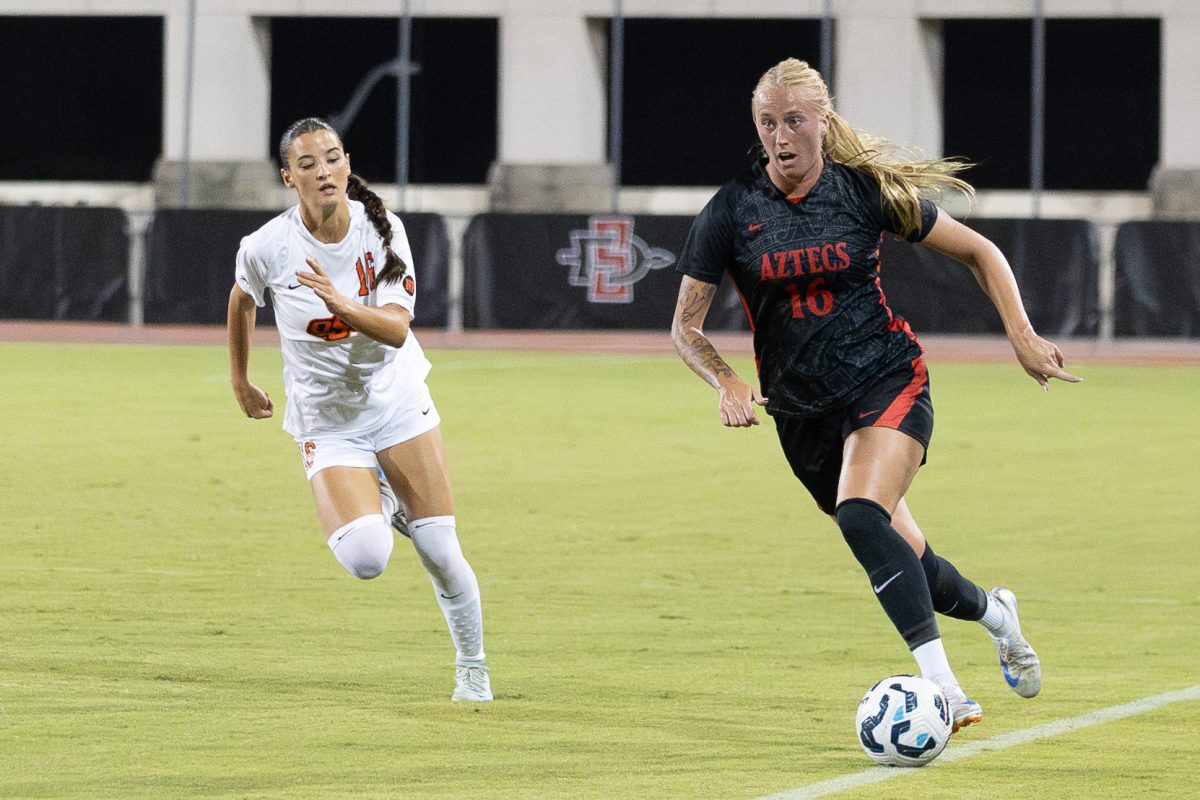 SDSU defender Trinity Coker runs along the sideline during an attack against OSU.