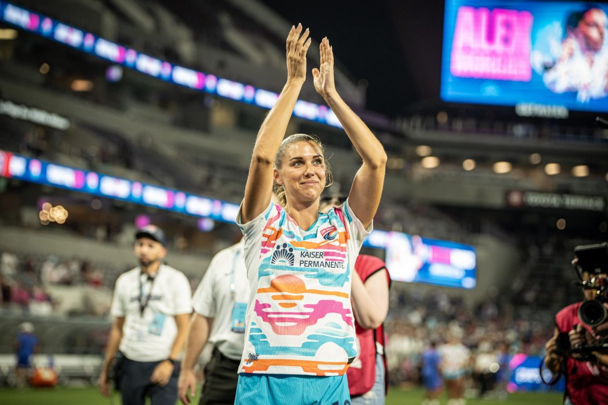 San Diego Wave FC captain and forward Alex Morgan looks onto the home crowd in applause as she walks off after her final career match at SnapDragon Stadium on Sunday, Sept 8. 