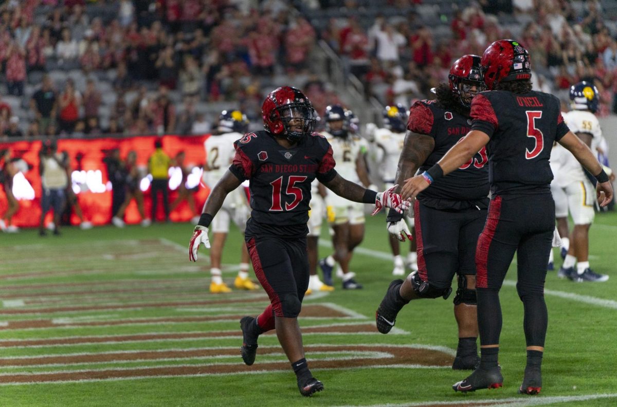 Marquez Cooper celebrates a touchdown in the end zone against the Texas A&M Commerce Lions at Snapdragon stadium Aug. 31, 2024