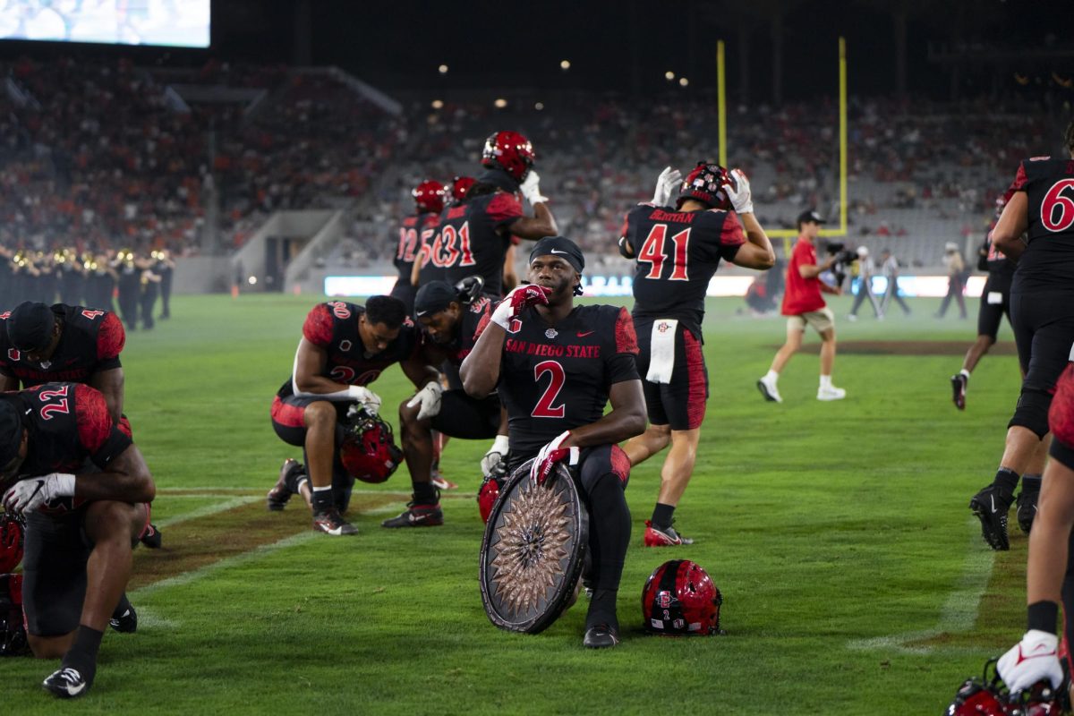 Aztec players prepare for their matchup against the Oregon State Beavers at Snapdragon Stadium on Saturday, Sept. 7.