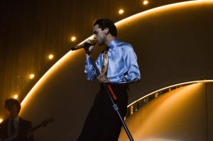 Stephen Sanchez sings into the microphone at San Diego State University’s Cal Coast Credit Union Amphitheater on Sept. 15, 2024.