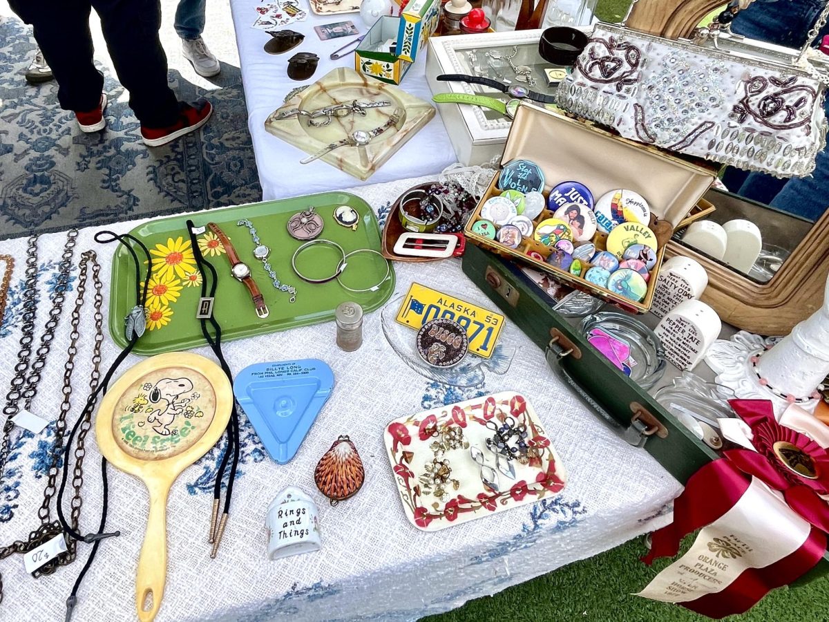 Hullabaloo's and Green Devils' shops at  Hotspot Flea Market filled with jewelry, retro pins and nostalgic trinkets.