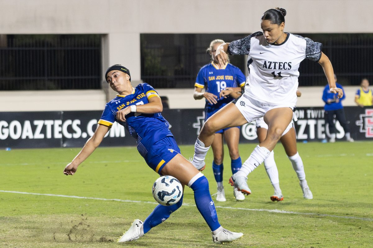 San Diego State midfielder Denise Castro tries to shoot past the San Jose State defense on Thursday, Oct. 17 at the SDSU Sports Deck. 