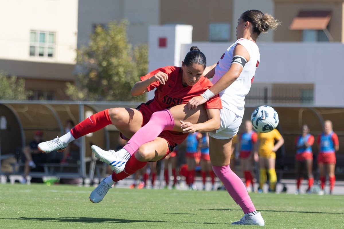 San Diego State midfielder Denise Castro battles a Fresno State defender inside the penalty area at the SDSU Sports Deck on Sunday, Oct. 20. 