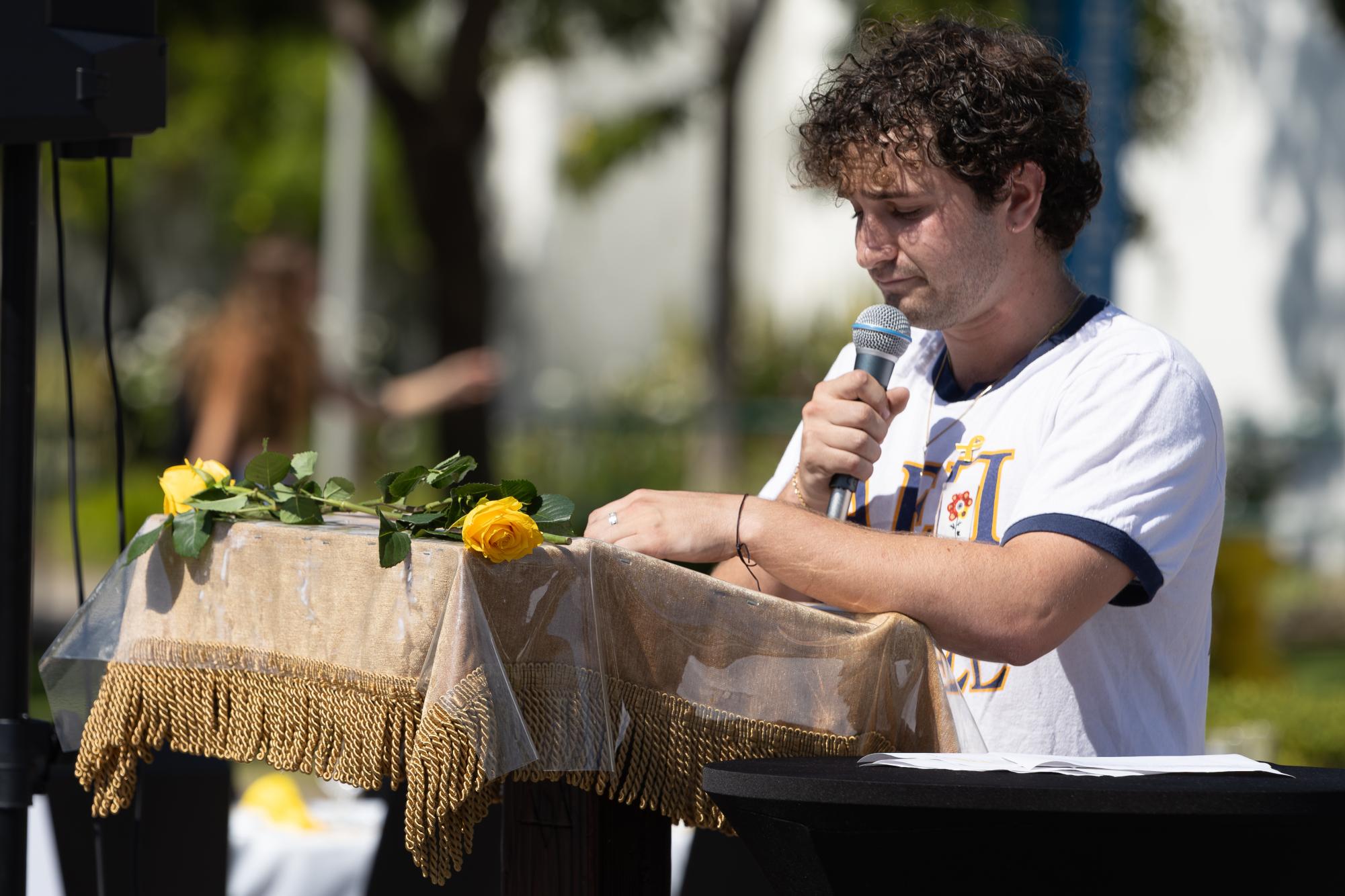 Student leader Ori Ierer takes the podium and gives an emotional speech about his year-long journey on Monday, Oct. 7, 2024, in front of Hepner Hall at SDSU.