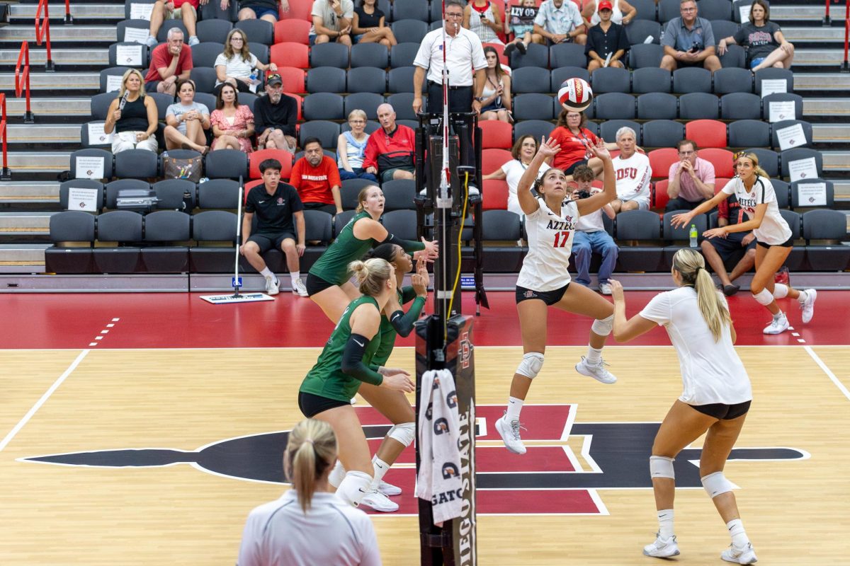 San Diego State setter Andrea Campos focuses on setting the ball for her teammates in the match against Portland State on Friday, Sept. 6 at the Aztec Court inside Peterson's Gym. She is second in assist on the team with 21.