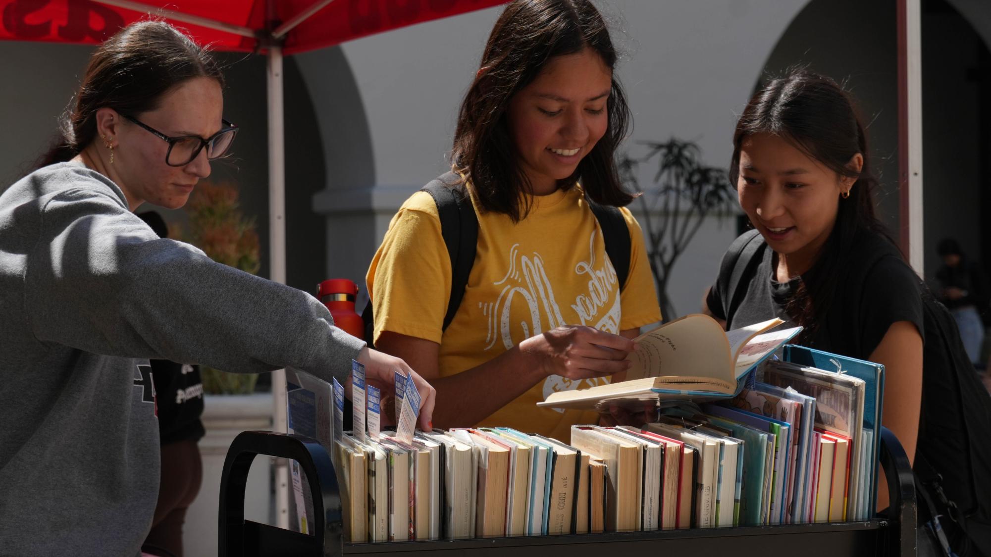 SDSU students look over books at the Freed Between the Lines event on Sept. 26, 2024 at the Student Union