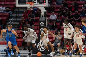 San Diego State Nick Boyd dribbles the ball up the court with his teammates against Cal State San Marcos on Oct. 30, 2024 at Viejas Arena. 