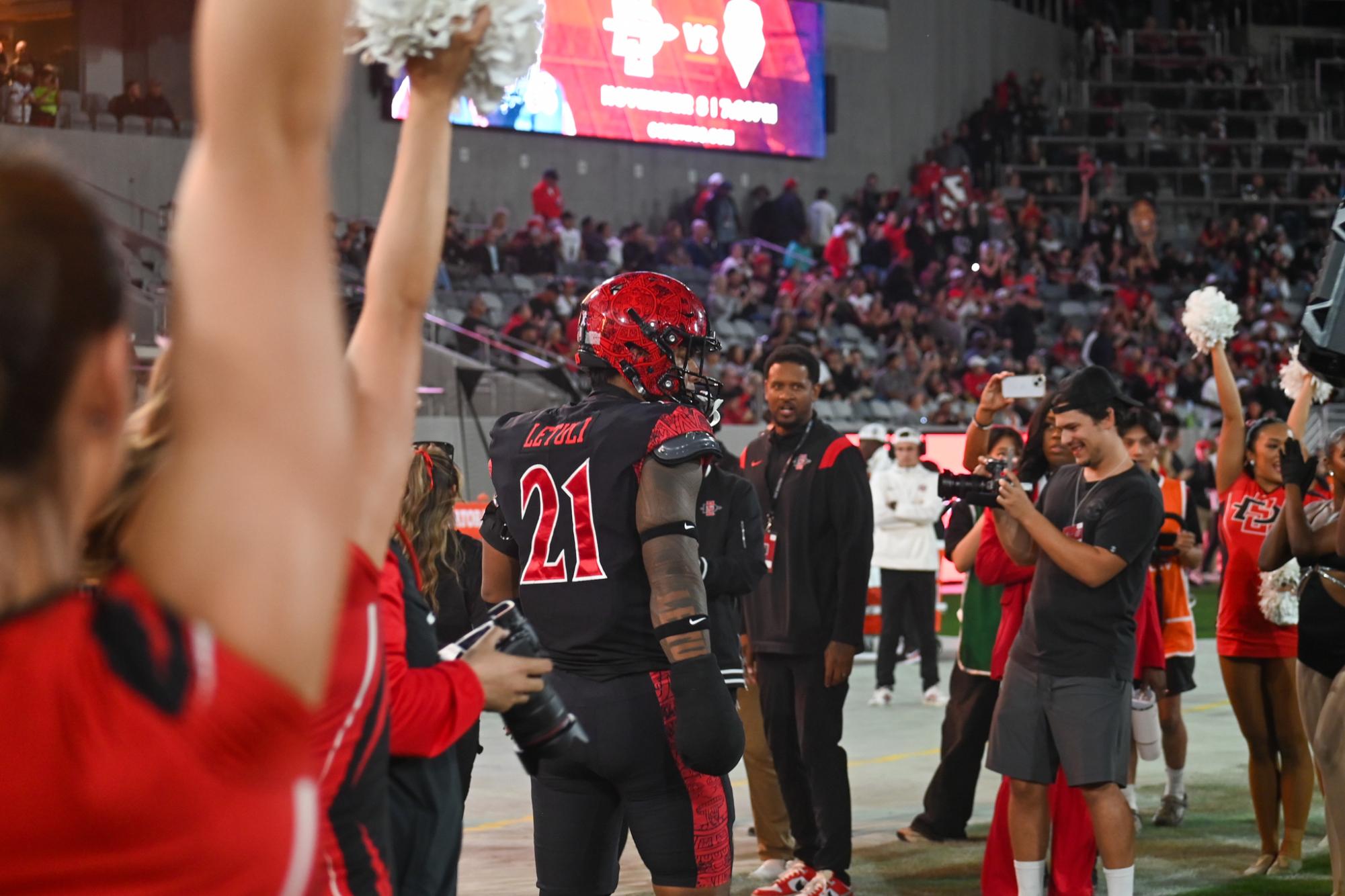 Sophomore linebacker Tano Letuli rallies after the pre-game entrance before San Diego State's game against Washington State on Oct. 26, 2024.