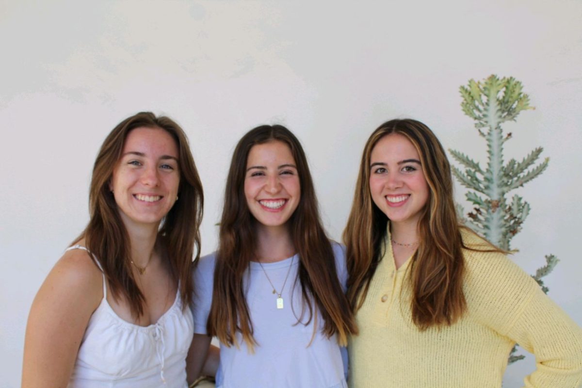 Brooke Faure (left), Jessica Johnson (center) and Maddie Meno (right) share a smile while posing for a Creative Collective magazine photo. Photo courtesy of Creative Collective magazine