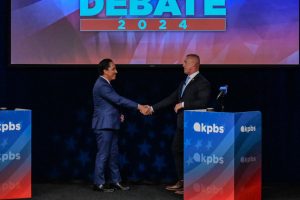 San Diego Mayor Todd Gloria and challenger Larry Turner shake hands at the end of the 2024 San Diego mayoral debate on Oct. 3, 2024