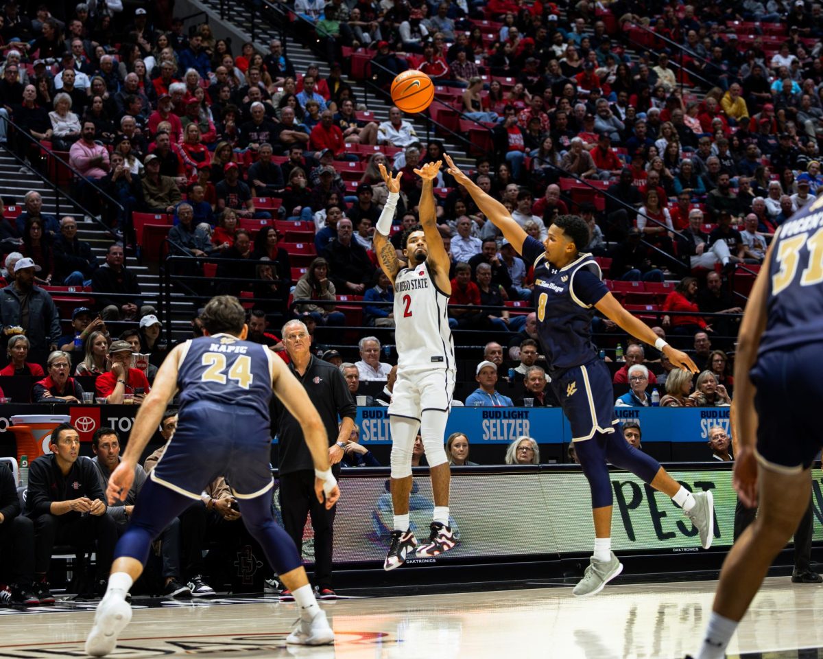 Guard Nick Boyd shoots a 3 over UCSD Wednesday, Nov. 6 at Viejas Arena. He would finish with 11 points shooting 33% from beyond the arc.