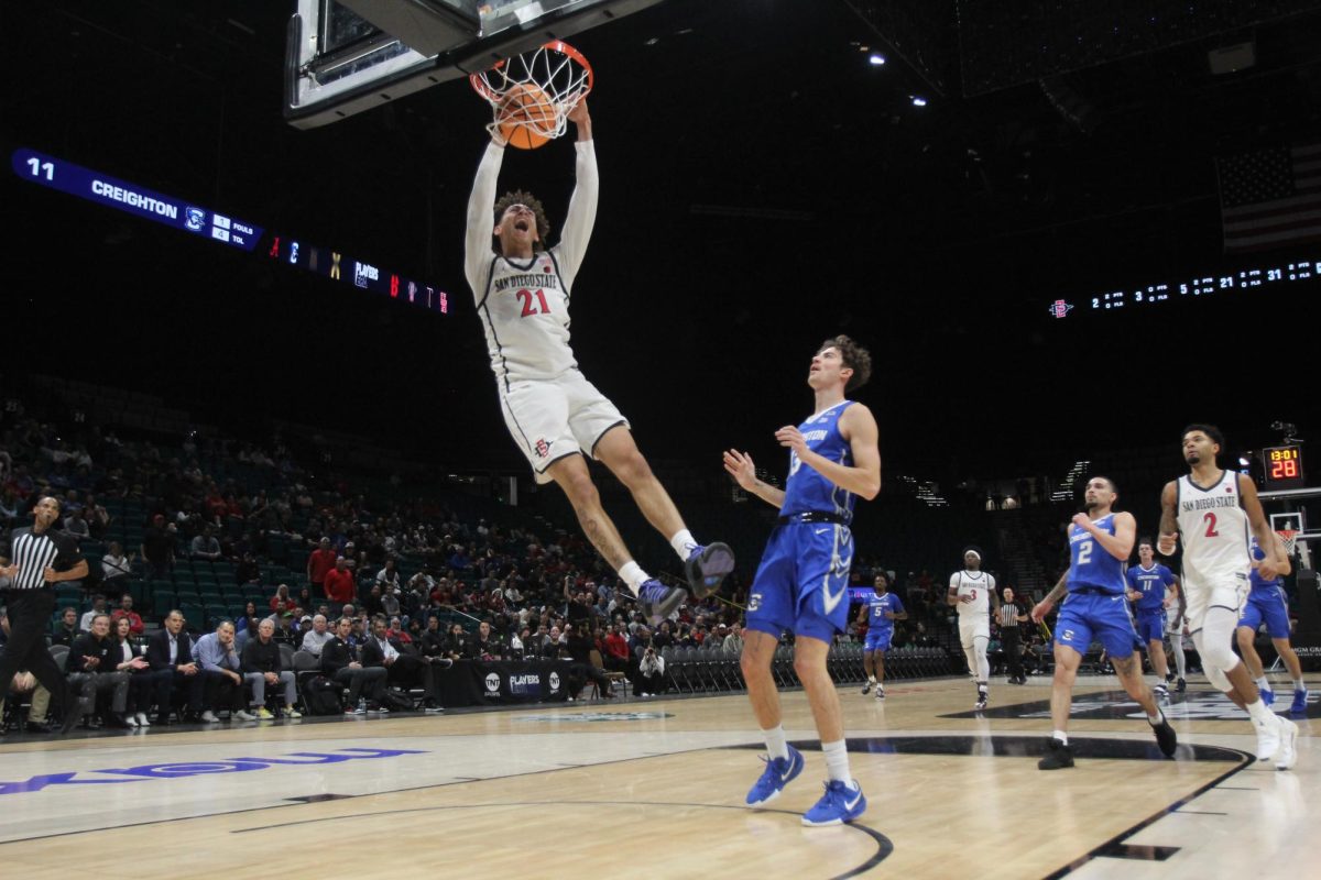 Dunking the ball, San Diego State sophomore guard Miles Byrd earns a basket during a game versus Creighton University at MGM Grand Garden Arena. 