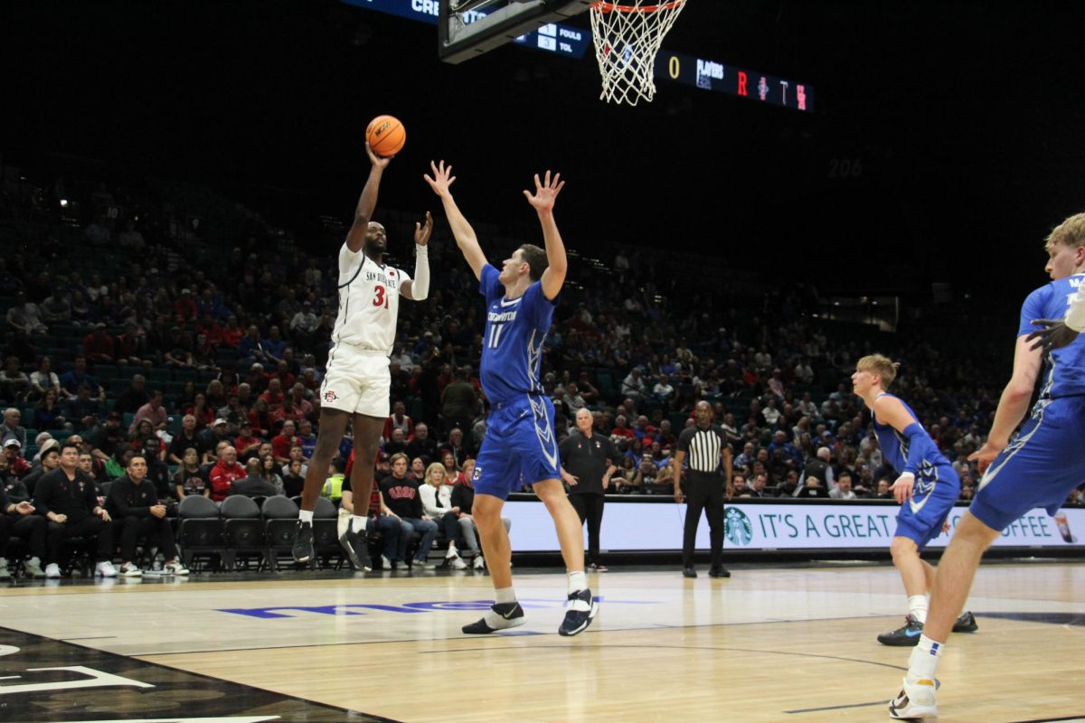 San Diego State snior forward Jared Coleman-Jones launches into the air to score against Creighton University at MGM Grand Arena in Las Vegas, Nevada on Tuesday, Nov. 26. 